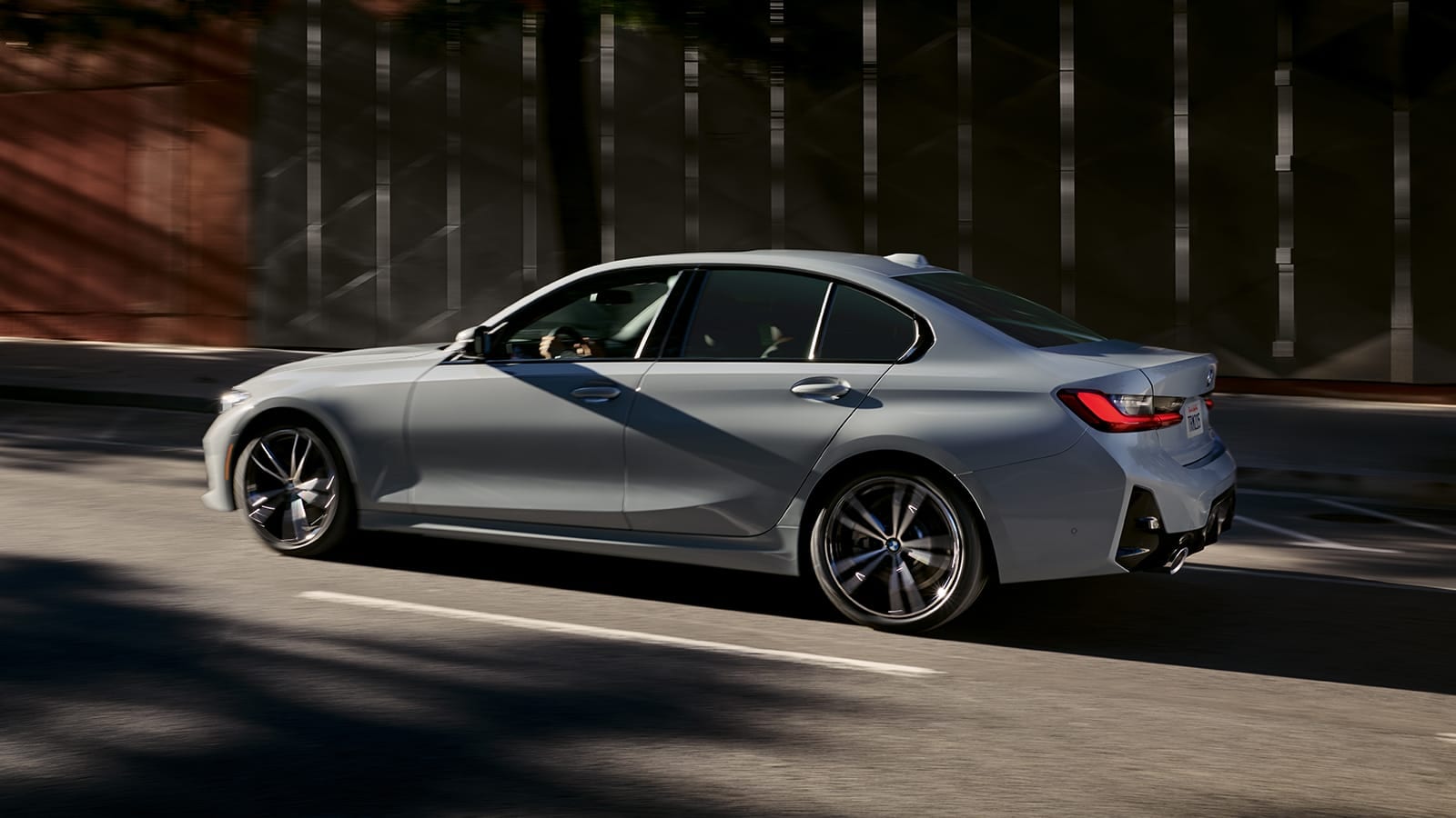 Gray 2023 BMW 3 Series in action